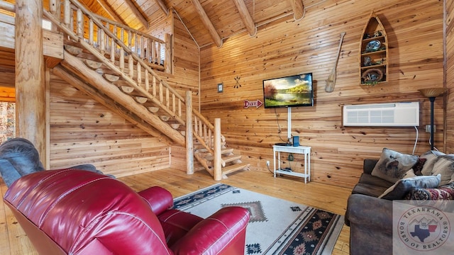 living room with wooden walls, wooden ceiling, stairway, beamed ceiling, and a wall mounted AC