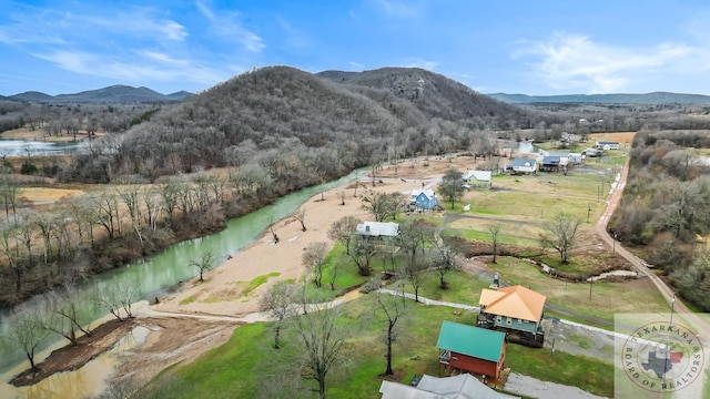 drone / aerial view with a water and mountain view