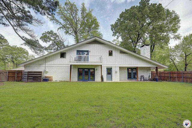 3009 Crestridge Dr, Texarkana, TX 75503 - rear view of property featuring a lawn, a fenced backyard, and french doors