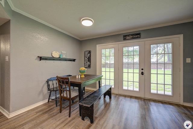 3009 Crestridge Dr, Texarkana, TX 75503 - dining space featuring baseboards, crown molding, french doors, and wood finished floors