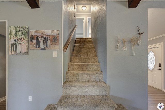 3009 Crestridge Dr, Texarkana, TX 75503 - stairs featuring wood finished floors, beam ceiling, and crown molding