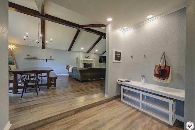 3009 Crestridge Dr, Texarkana, TX 75503 - interior space with a textured wall, vaulted ceiling with beams, baseboards, and wood finished floors