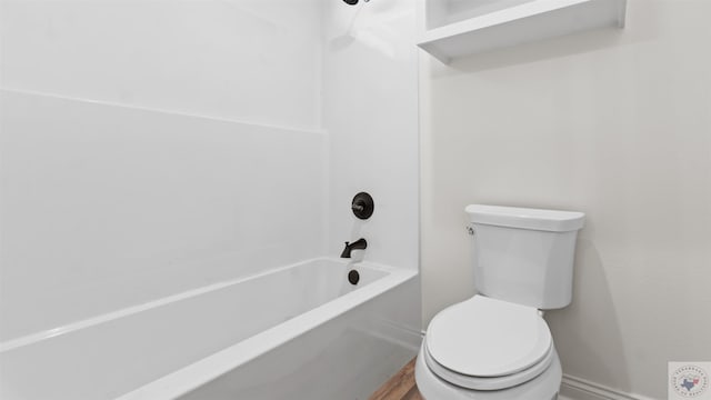 bathroom with toilet and bathtub / shower combination