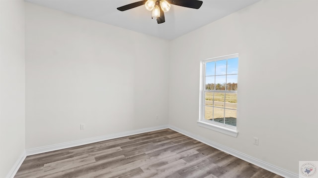 unfurnished room featuring ceiling fan and hardwood / wood-style floors