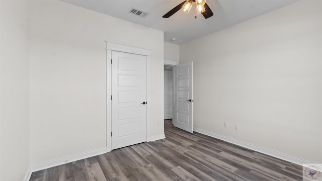 unfurnished bedroom with ceiling fan and hardwood / wood-style floors