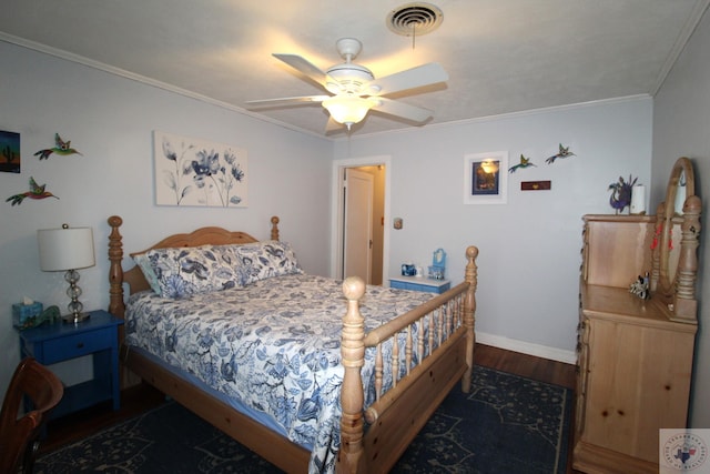 bedroom featuring ceiling fan, dark wood-type flooring, and ornamental molding