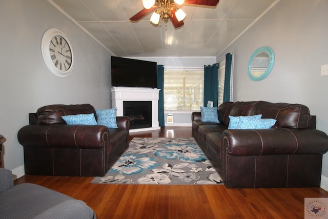 living room featuring crown molding, hardwood / wood-style flooring, and ceiling fan