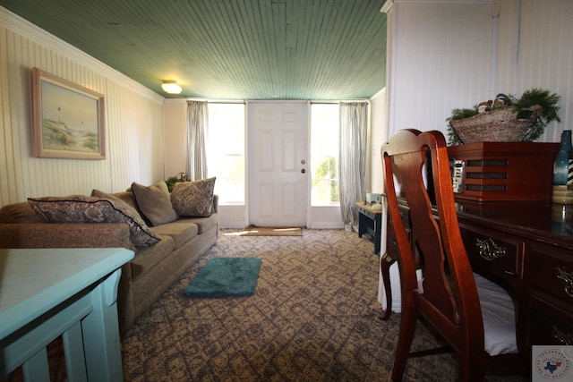 carpeted living room featuring crown molding