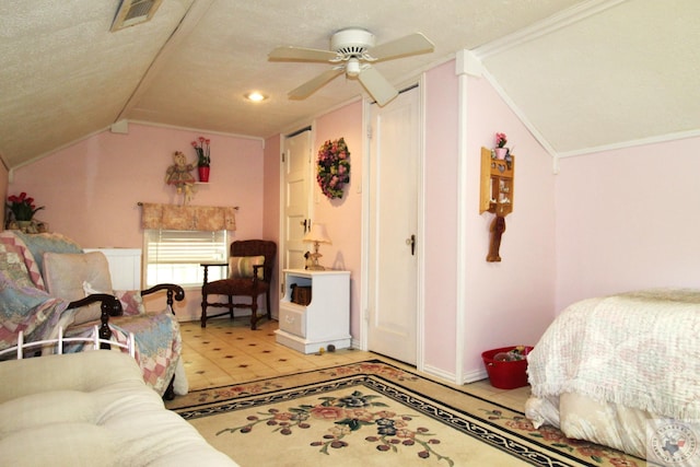 interior space featuring crown molding, a textured ceiling, lofted ceiling, and ceiling fan