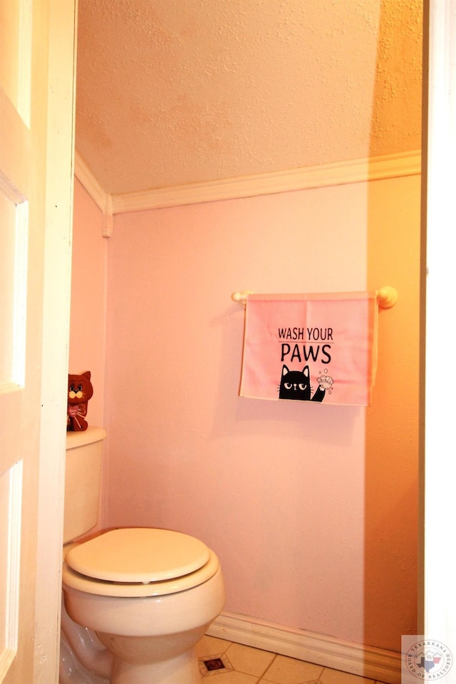 bathroom featuring toilet, ornamental molding, and tile patterned flooring