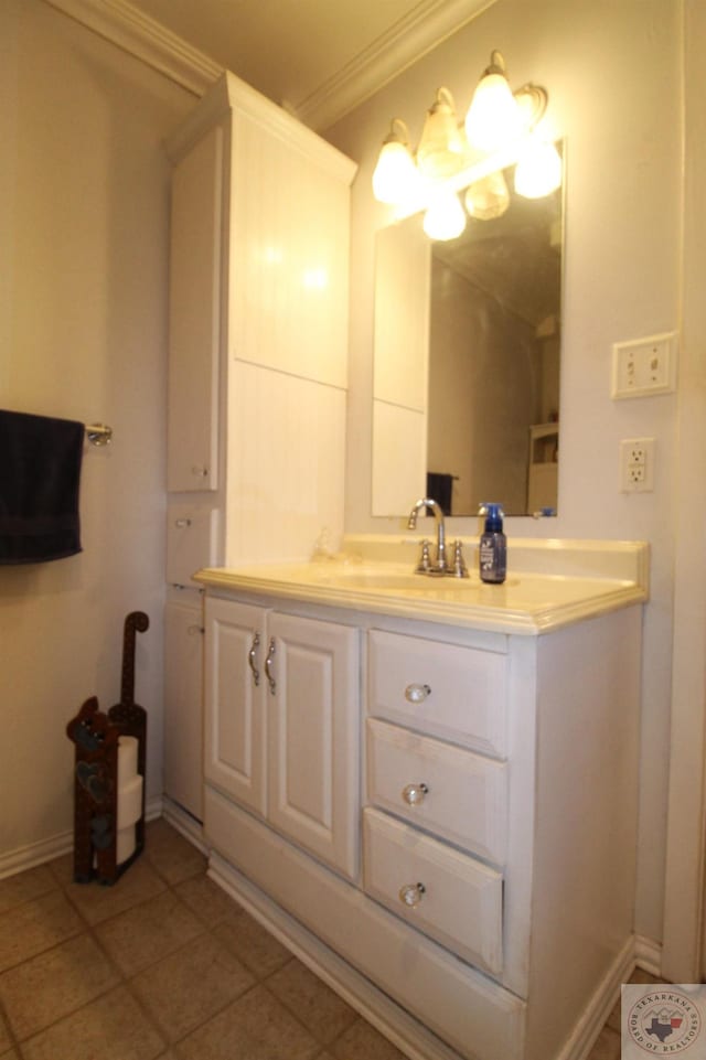 bathroom featuring vanity, crown molding, and tile patterned flooring