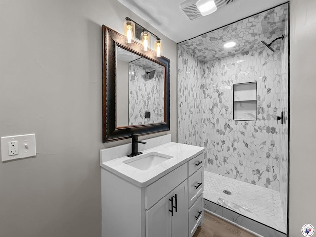 202 Main St, Hooks, TX 75561 - full bath with a shower stall, vanity, and wood finished floors