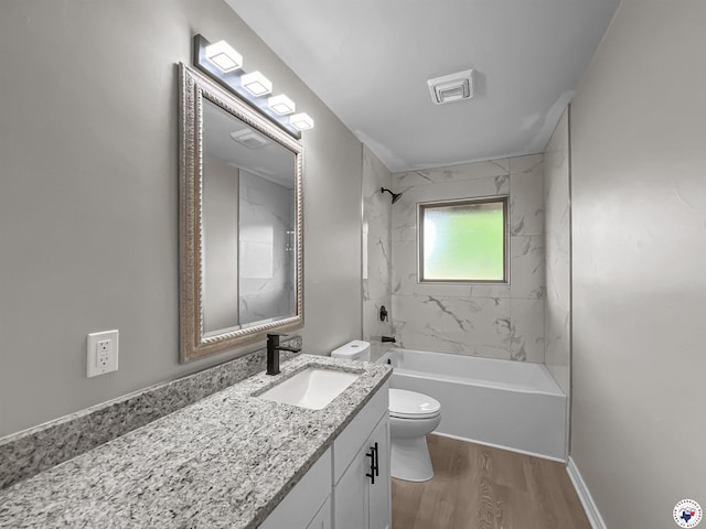 202 Main St, Hooks, TX 75561 - bathroom featuring toilet, vanity, wood finished floors, and bathing tub / shower combination