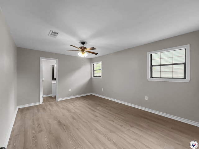 202 Main St, Hooks, TX 75561 - empty room with light wood-type flooring, baseboards, and ceiling fan