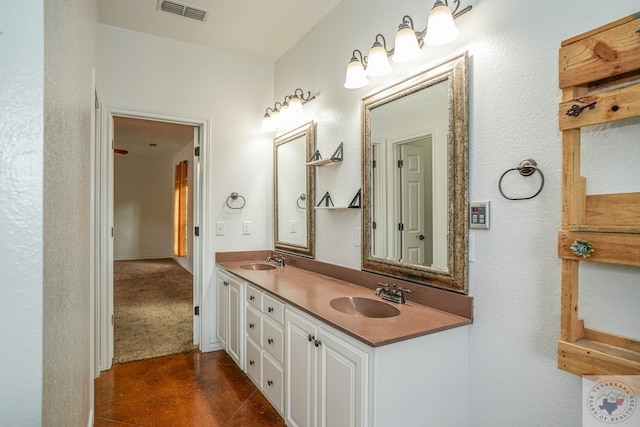 bathroom with tile patterned flooring and vanity