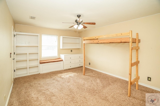 unfurnished bedroom with light colored carpet and ceiling fan