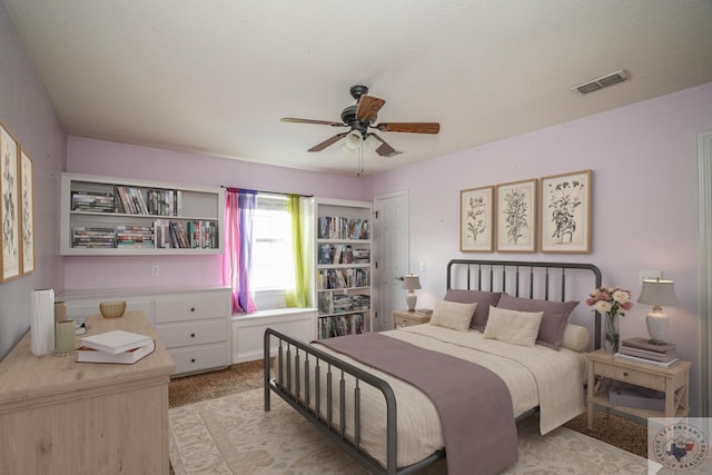 bedroom featuring ceiling fan and a closet