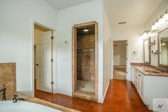 bathroom with vanity, shower with separate bathtub, and tile patterned flooring