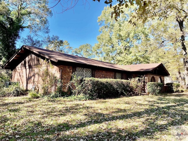 view of property exterior featuring a yard