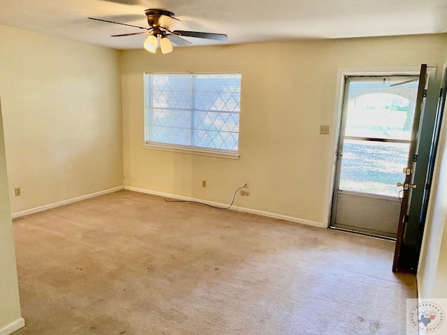 unfurnished room featuring light carpet and ceiling fan