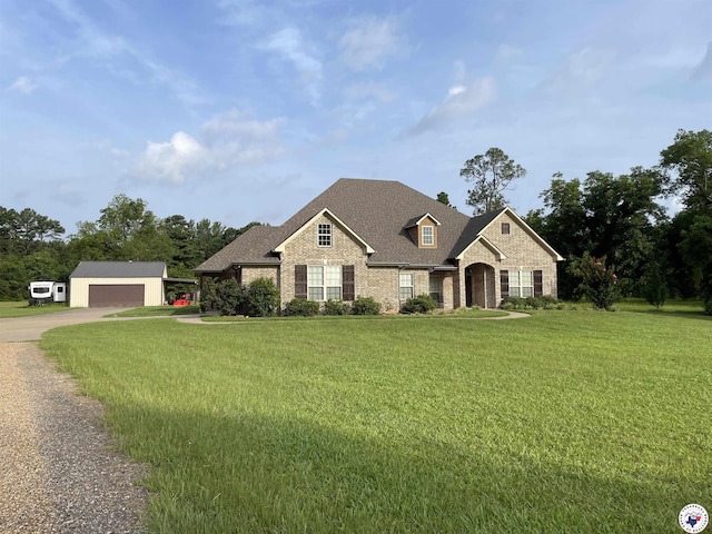 701 Tri State Rd, Texarkana, TX 75501 - view of front of home featuring brick siding, a front lawn, and driveway