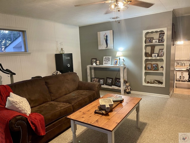 carpeted living room featuring ceiling fan