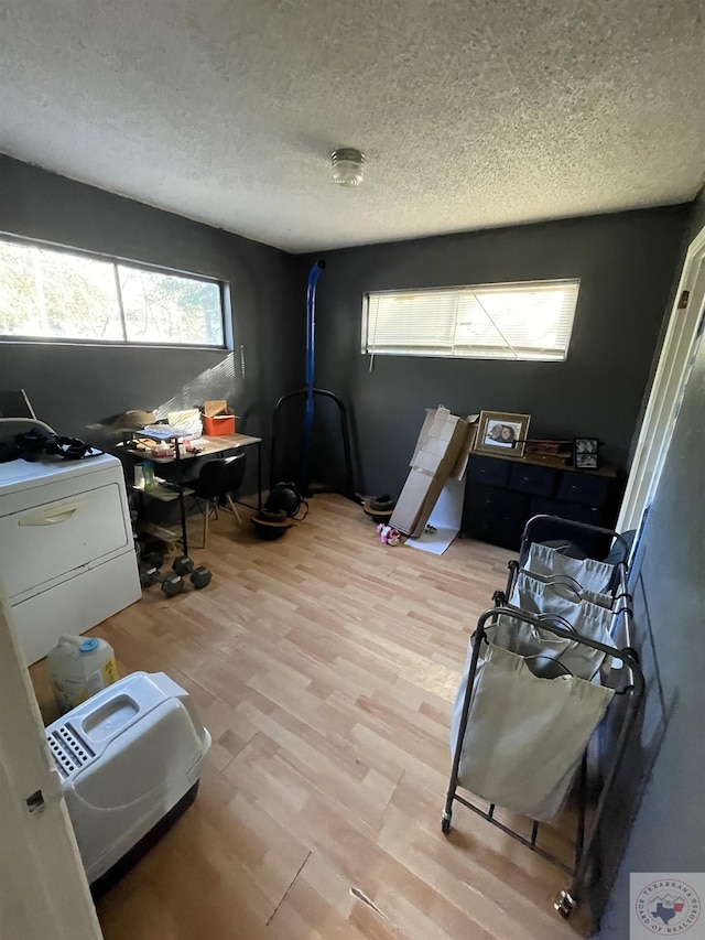 office featuring a textured ceiling and light hardwood / wood-style flooring