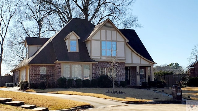 tudor-style house with a garage