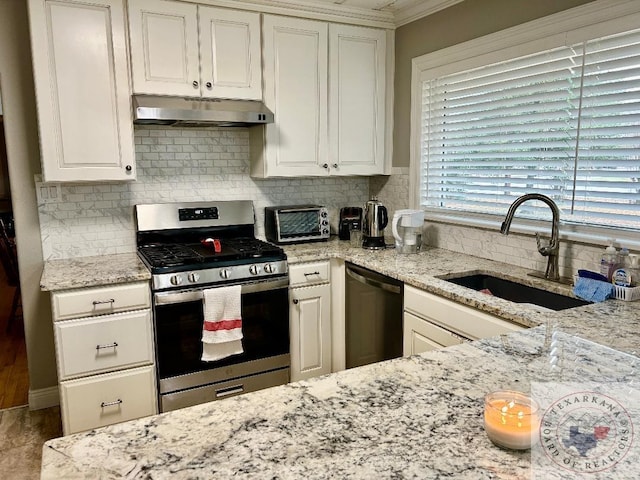 kitchen with tasteful backsplash, dishwasher, sink, and stainless steel range with gas stovetop