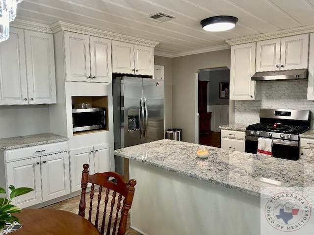 kitchen featuring light stone counters, appliances with stainless steel finishes, crown molding, and white cabinets