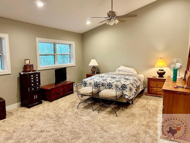 bedroom with light carpet, vaulted ceiling, and ceiling fan