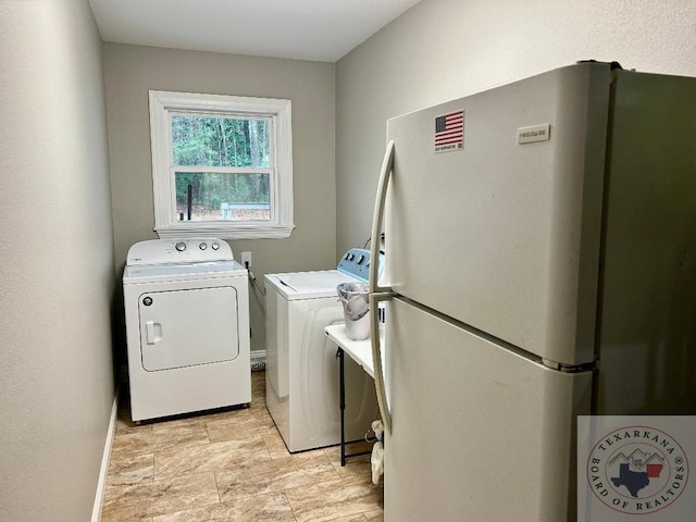 washroom featuring washer and dryer