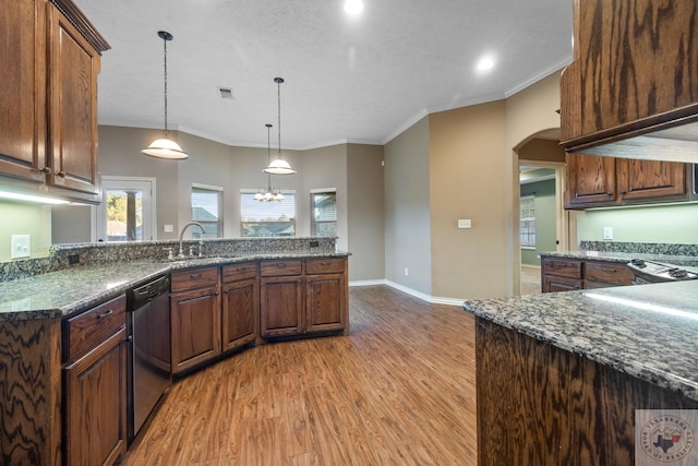 kitchen with crown molding, hanging light fixtures, stainless steel dishwasher, sink, and light hardwood / wood-style flooring