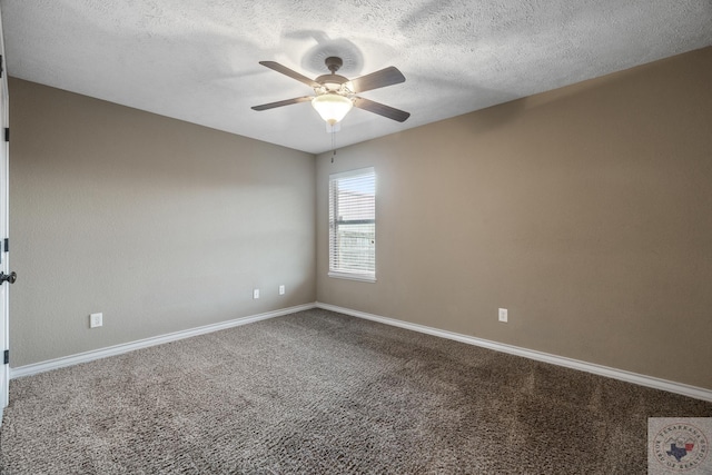 carpeted spare room with a textured ceiling and ceiling fan