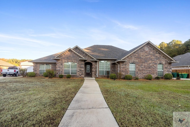 single story home with a front yard