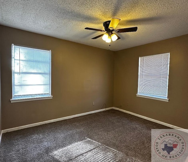 carpeted spare room with ceiling fan and a textured ceiling