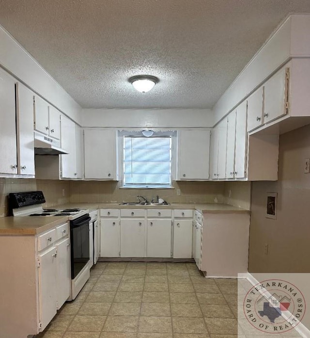 kitchen featuring sink, white cabinetry, range with electric stovetop, and a textured ceiling