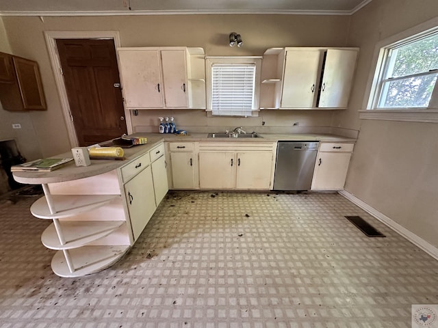 kitchen with sink, stainless steel dishwasher, kitchen peninsula, and crown molding