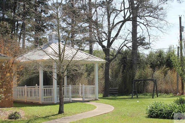 view of community with a gazebo and a yard