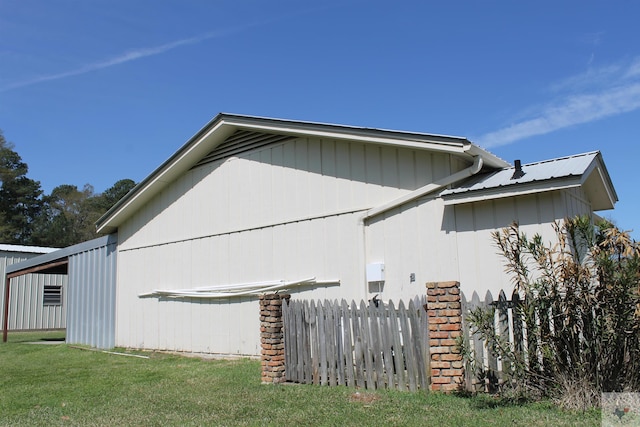 view of property exterior with a yard