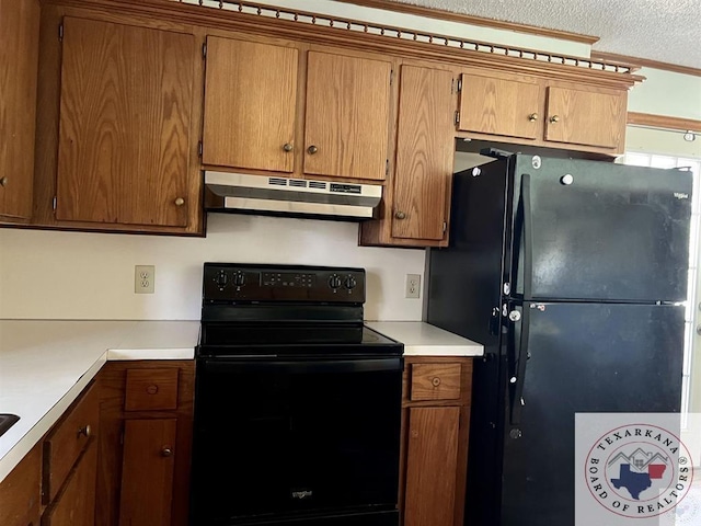 kitchen featuring black appliances and a textured ceiling