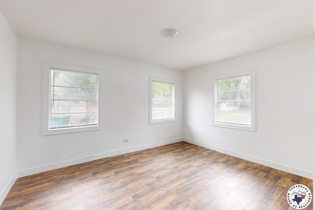 2451 Oaklawn Dr, Texarkana, TX 75501 - unfurnished room featuring baseboards and wood finished floors
