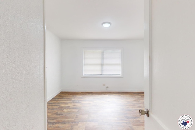 2451 Oaklawn Dr, Texarkana, TX 75501 - unfurnished room with baseboards and wood finished floors