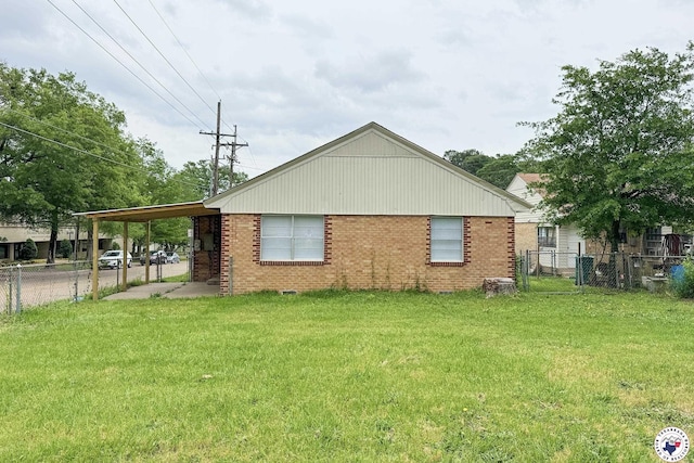 2451 Oaklawn Dr, Texarkana, TX 75501 - view of home's exterior featuring brick siding, fence, a lawn, and a carport