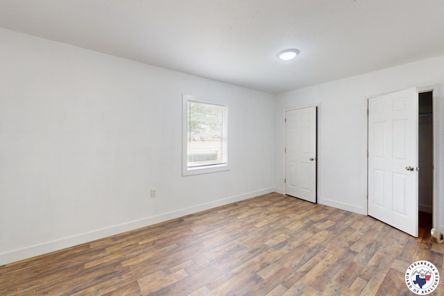 2451 Oaklawn Dr, Texarkana, TX 75501 - unfurnished bedroom featuring baseboards and wood finished floors