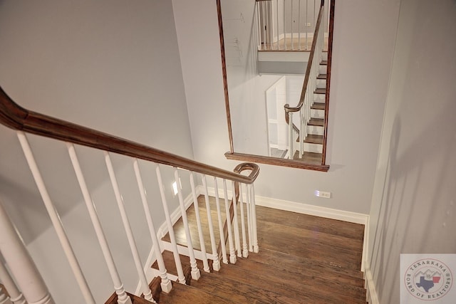 stairway with wood-type flooring