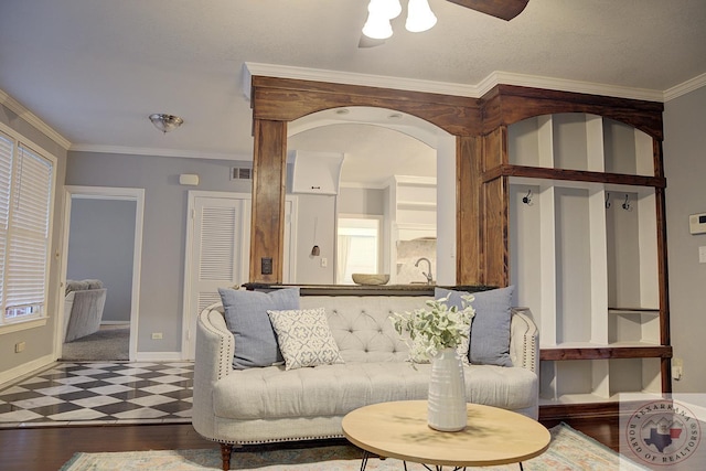 living room with dark wood-type flooring, sink, and ornamental molding