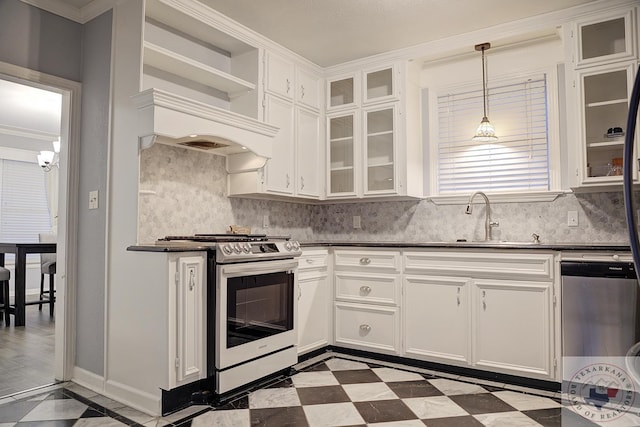 kitchen with hanging light fixtures, sink, white cabinets, ornamental molding, and stainless steel appliances