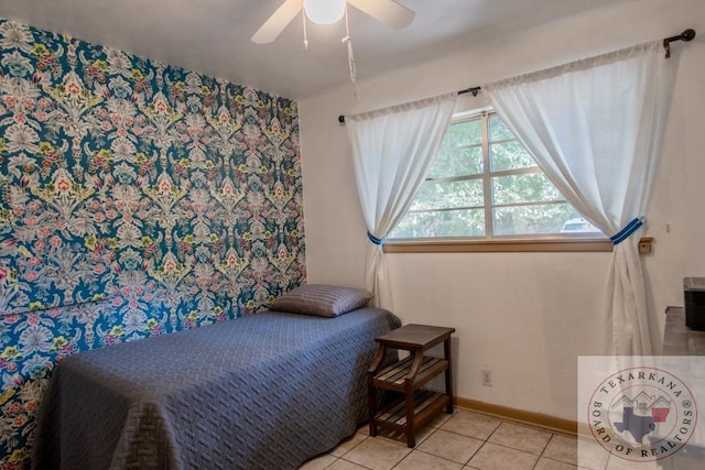 tiled bedroom featuring ceiling fan