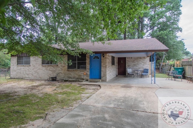 single story home featuring a patio